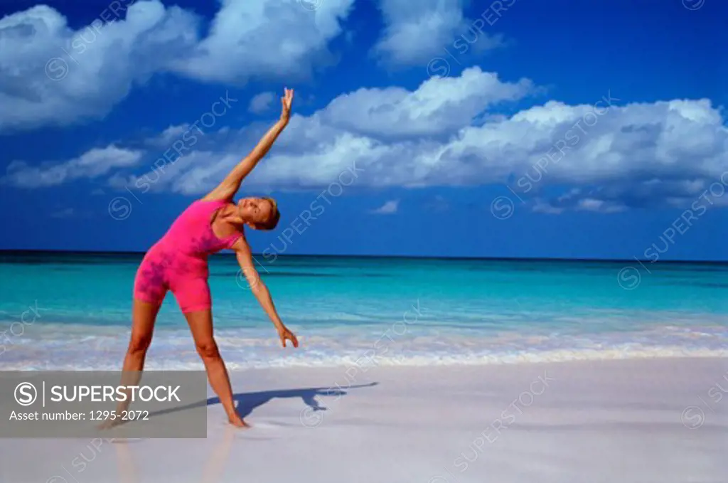 Woman meditating at the beach, Eleuthera, Bahamas
