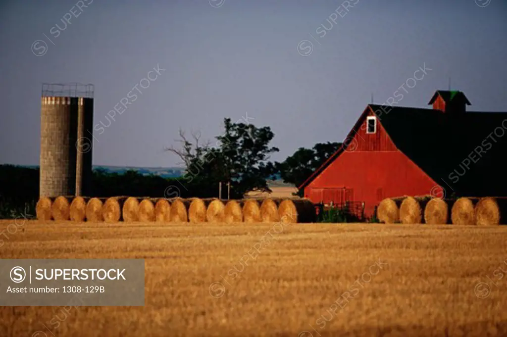 Bales of hay outside a barn, Kansas, USA