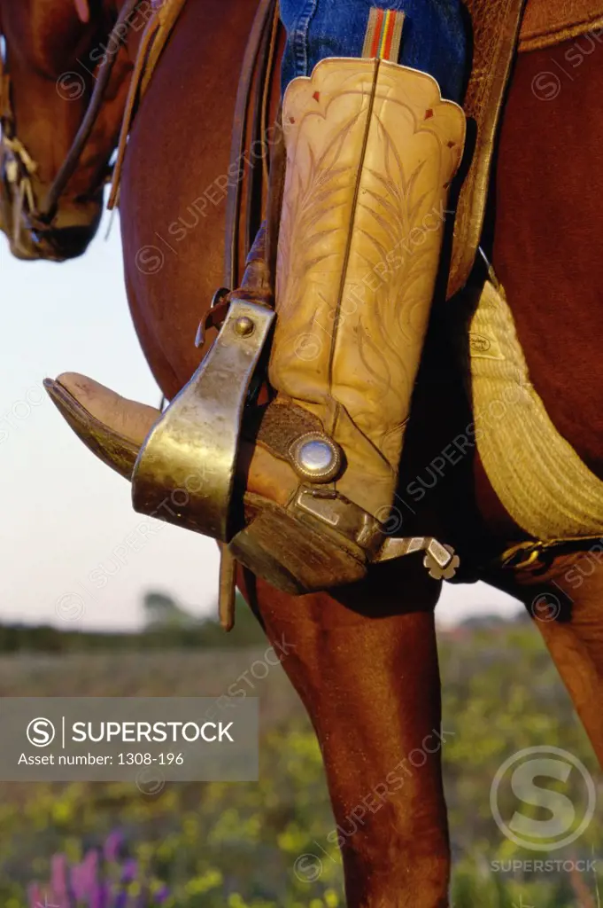 Close-up of a cowboy's foot in a stirrup