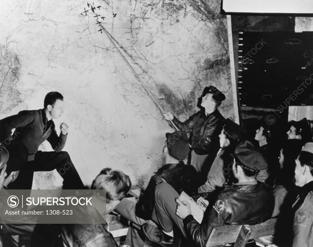 Group of soldiers talking in a room, 1940s