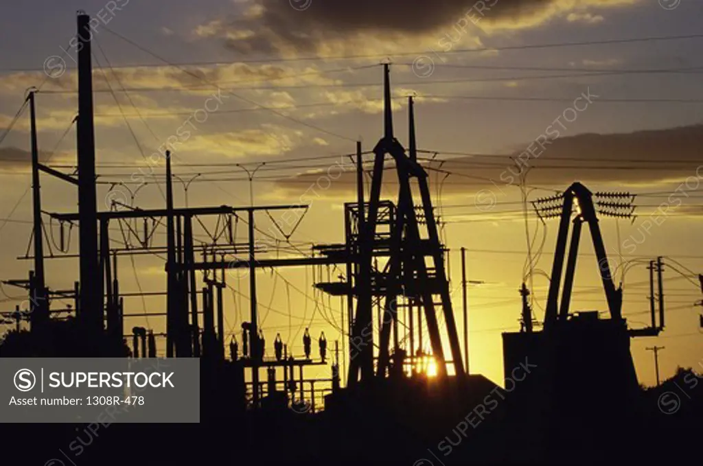 Silhouette of electric power pylons