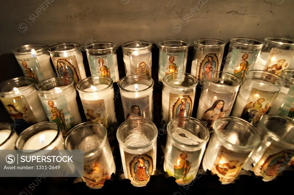 Votive candles in Catholic church, Chimayo, New Mexico, USA