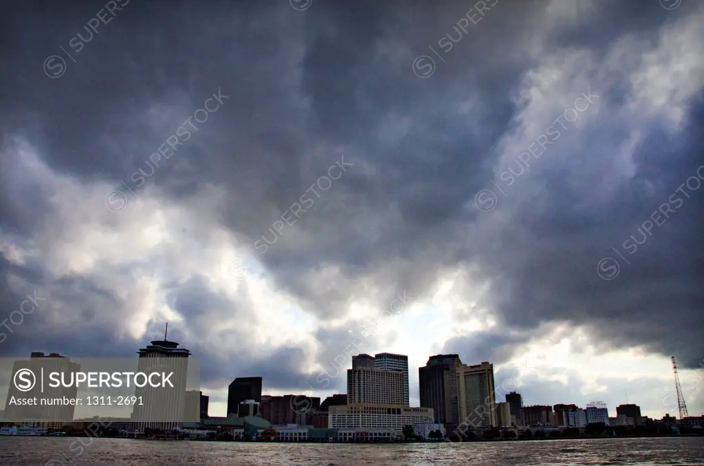 City skyline viewed from Algiers Point during an extremely high water level on The Mississippi River, New Orleans, Louisiana, USA