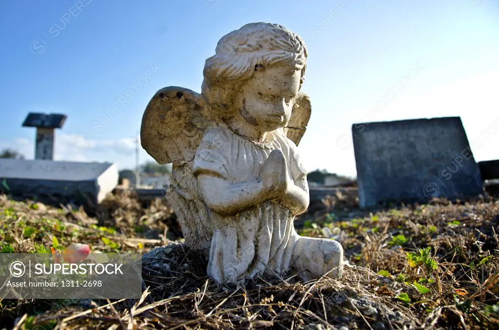 Statue of an angel at Holt Cemetery, New Orleans, Louisiana, USA