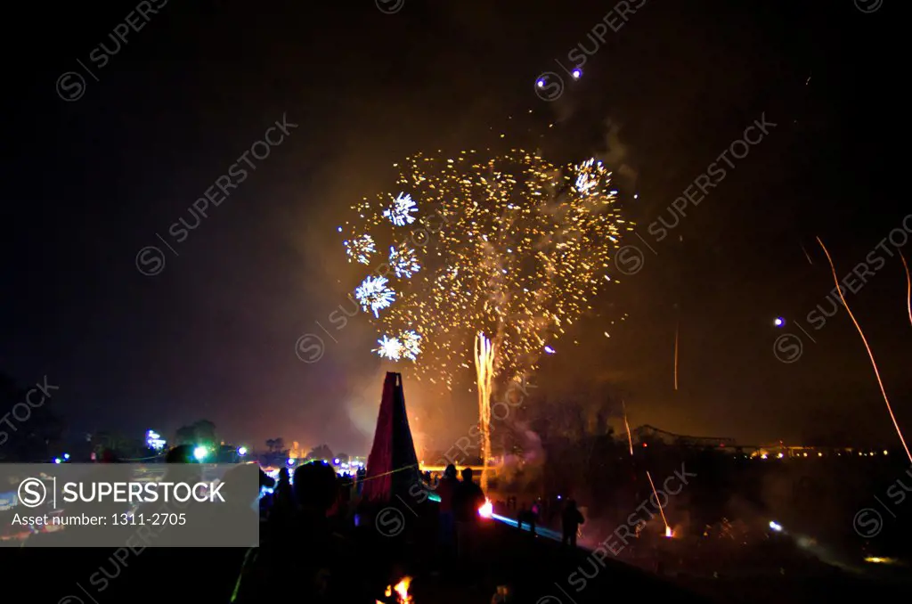 Bonfires and fireworks on the Mississippi River, Gramercy, St. James Parish, Louisiana, USA