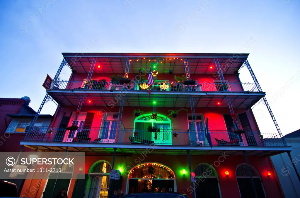 Decorated house lit up at dusk on Christmas, French Quarter, New Orleans, Louisiana, USA