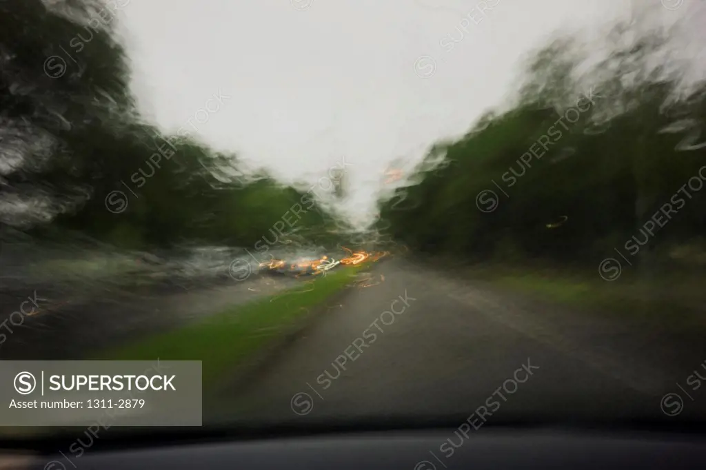 Driviing in a rainstorm from the driver's point of view.