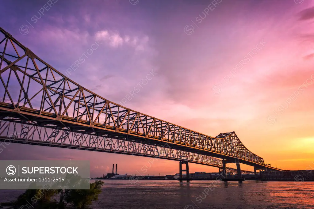 The Crescent City Connection is it spans The Mississippi River from the Westbanl at Point Algiers into New Orleans.