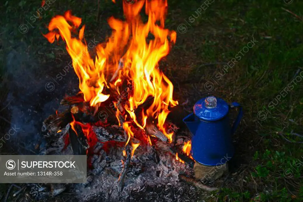 USA, Washington, close up of coffee pot near campfire