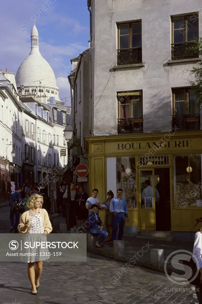 Young woman strolling in the street, Montmartre, Paris, France