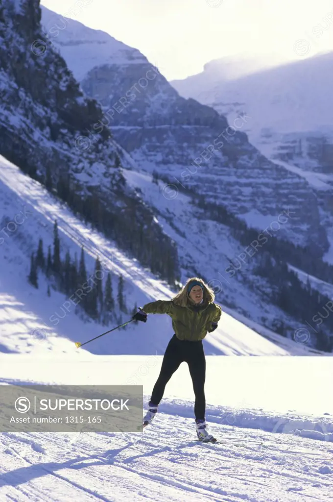 High angle view of a young woman skiing, Alberta, Canada