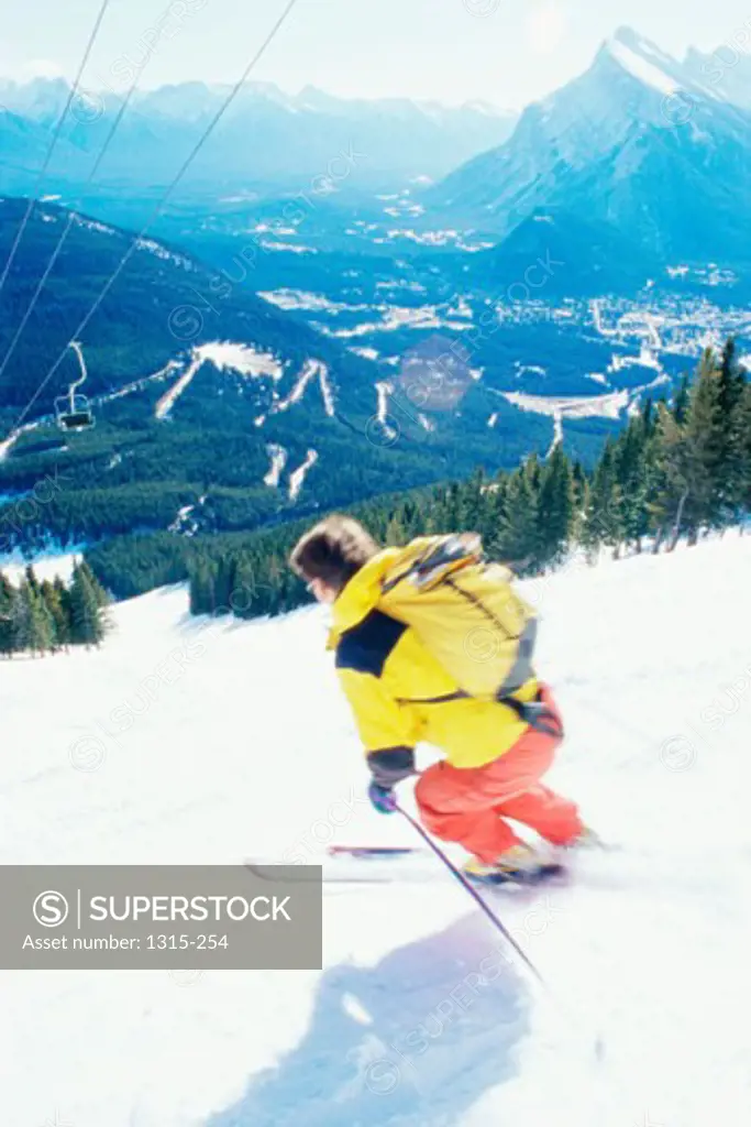 High angle view of a man skiing, Banff National Park, Alberta, Canada