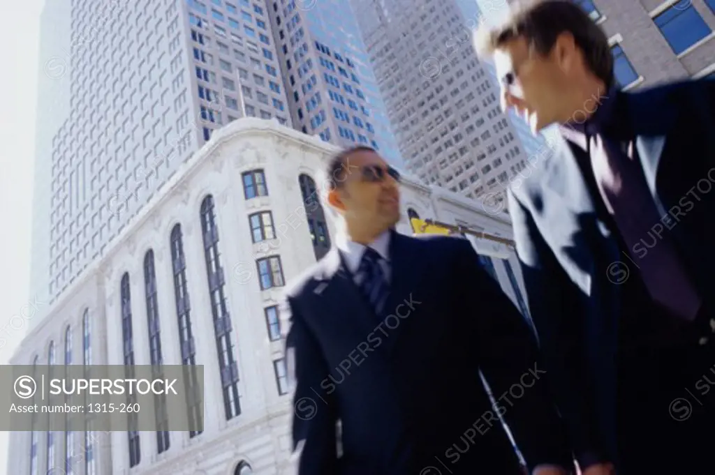 Low angle view of two businessmen walking