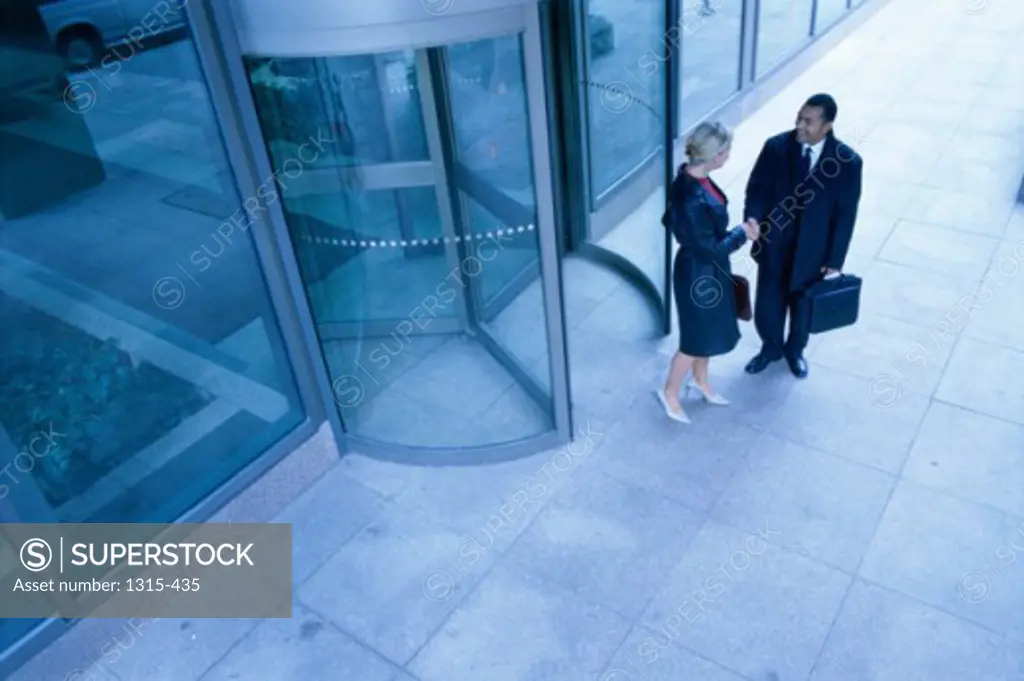 High angle view of business executives shaking hands