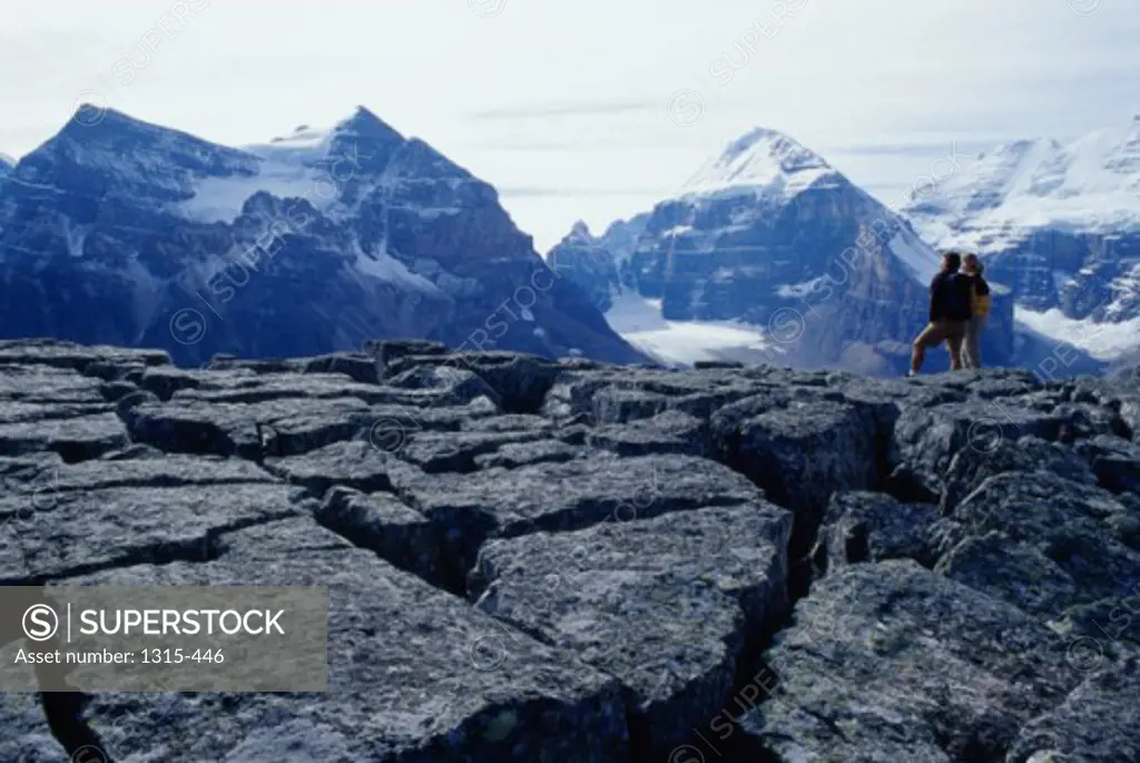 Rear view of people standing on a rock, Banff National Park, Alberta, Canada