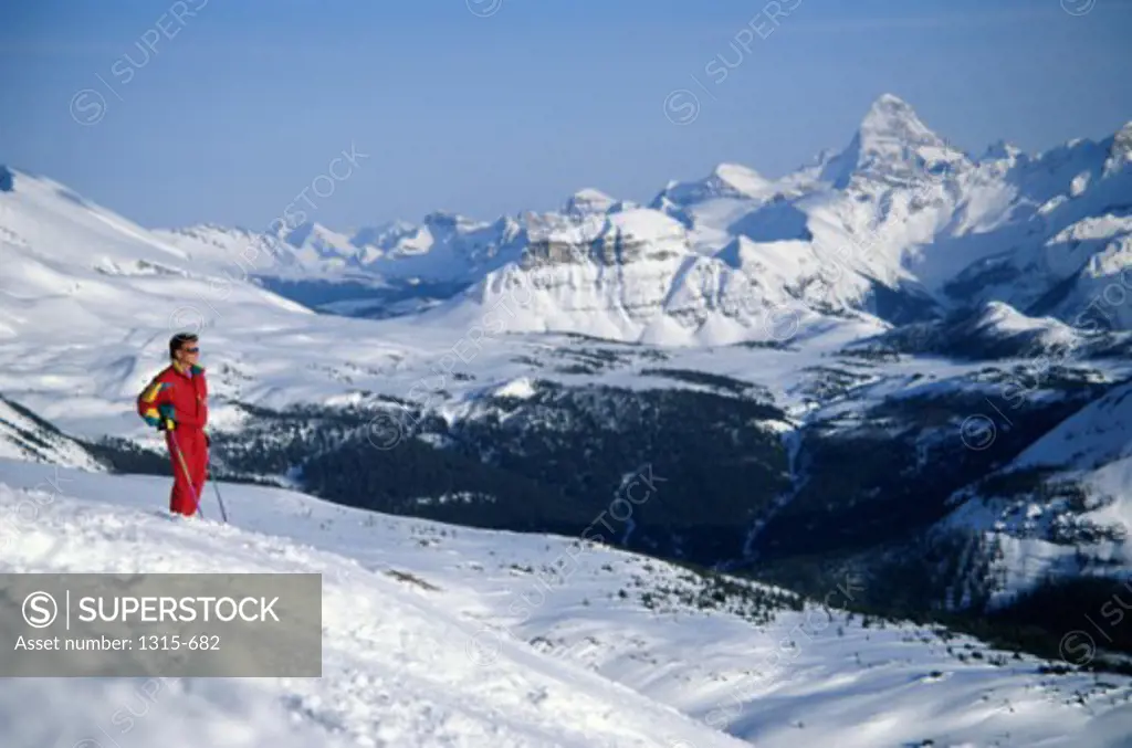 Man skiing on a hillside, Banff National Park, Alberta, Canada