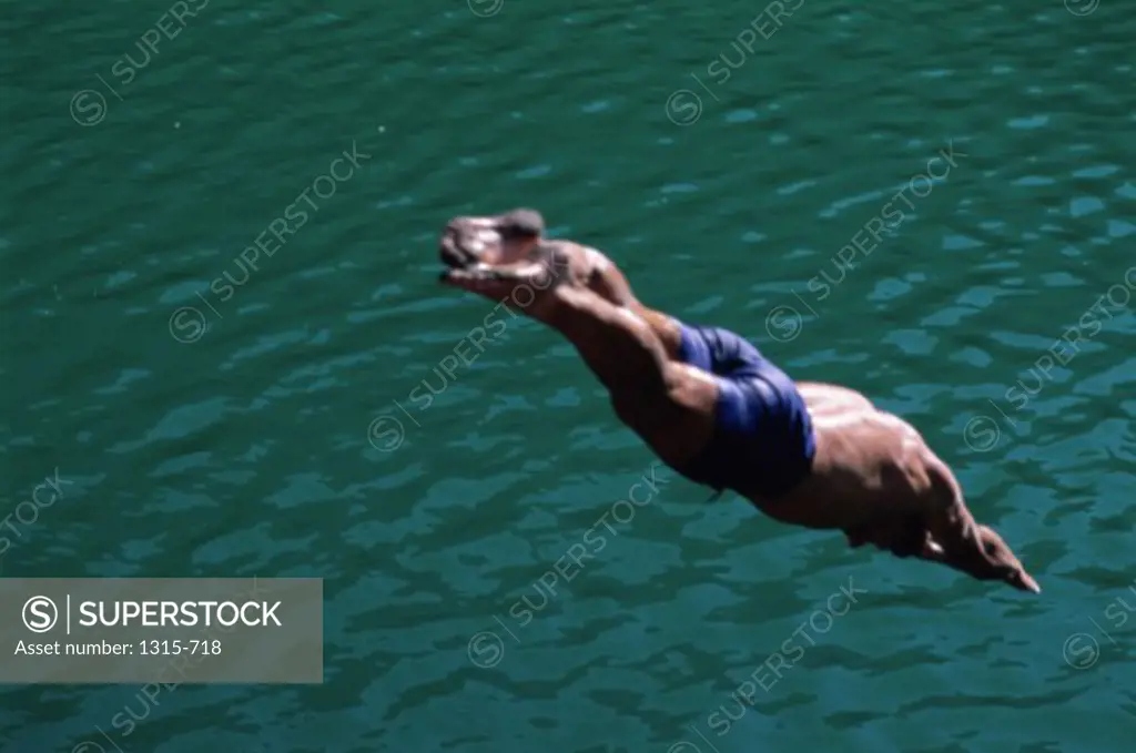 High angle view of a man diving into water
