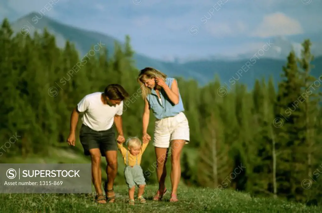 Parents walking with their son