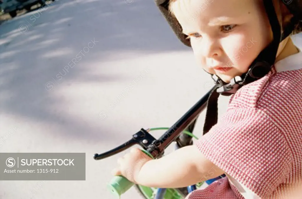 Close-up of a girl riding a bicycle