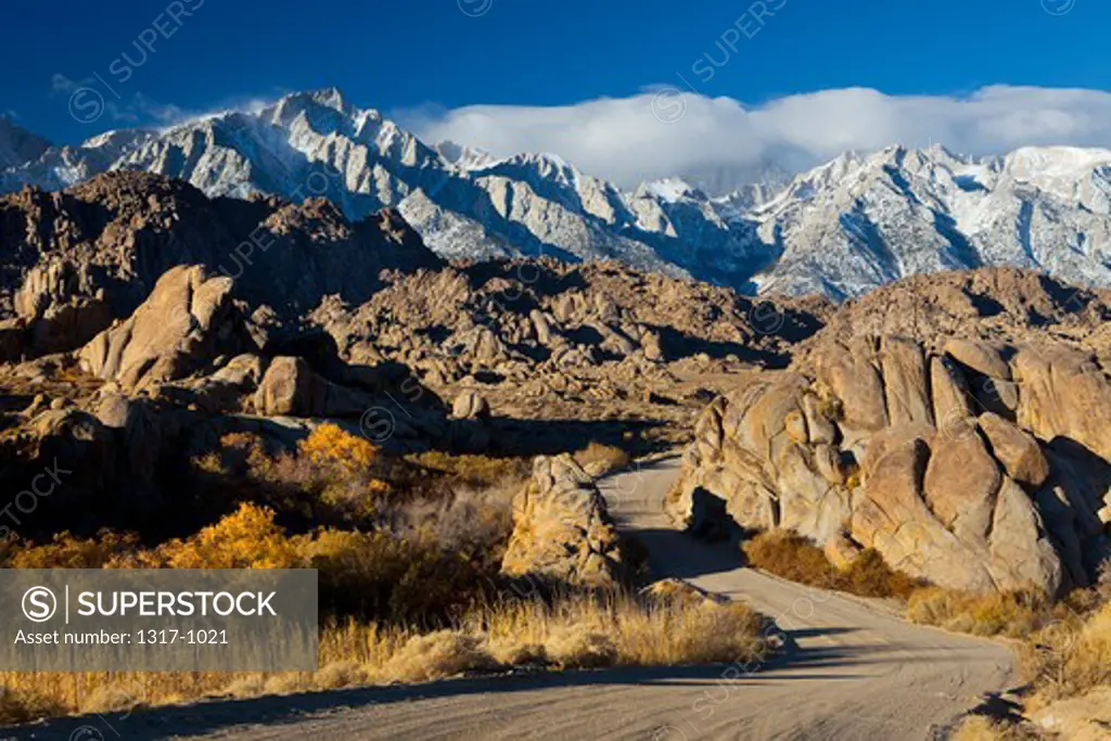 Dirt road with mountains in the background, Alabama Hills, Lone Pine Peak, Californian Sierra Nevada, California, USA