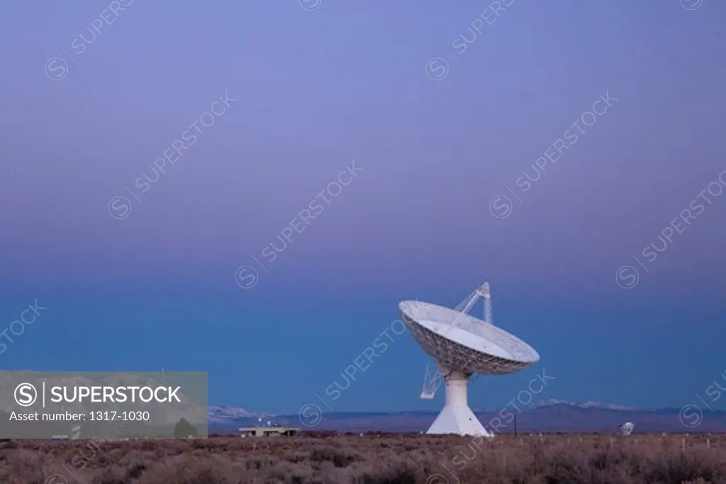 Radio telescope in a field at dawn, Owens Valley Radio Observatory, Owens Valley, California, USA