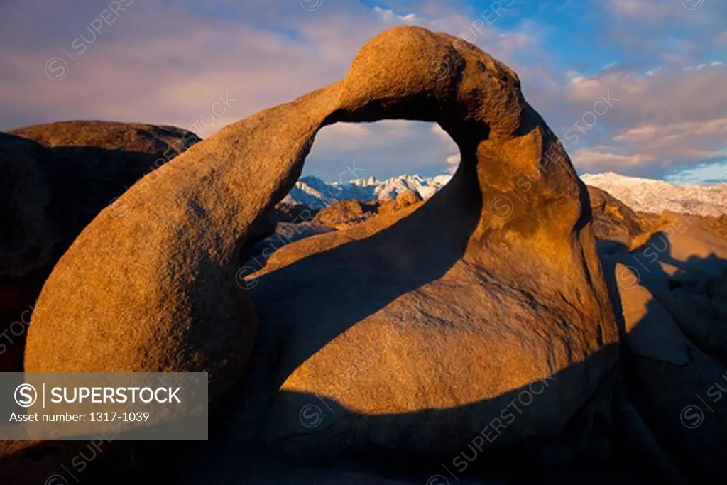 Sunlight falling on a natural arch, Mobius Arch, Alabama Hills, Lone Pine, California, USA
