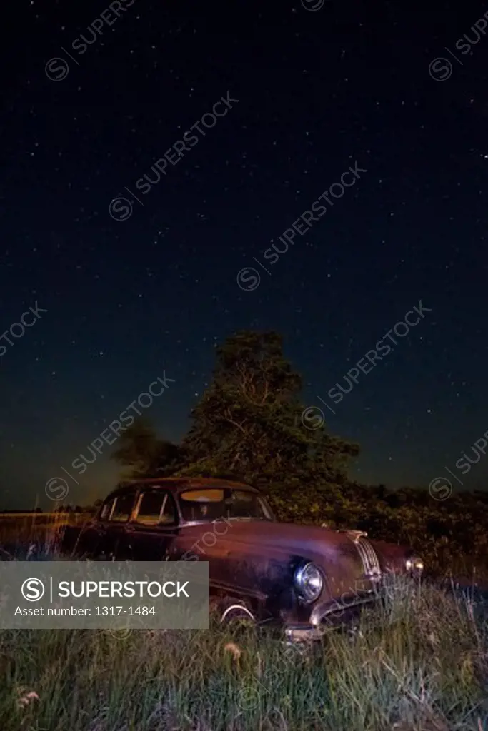 Abandoned old car in a field, Carneiro, Kansas, USA