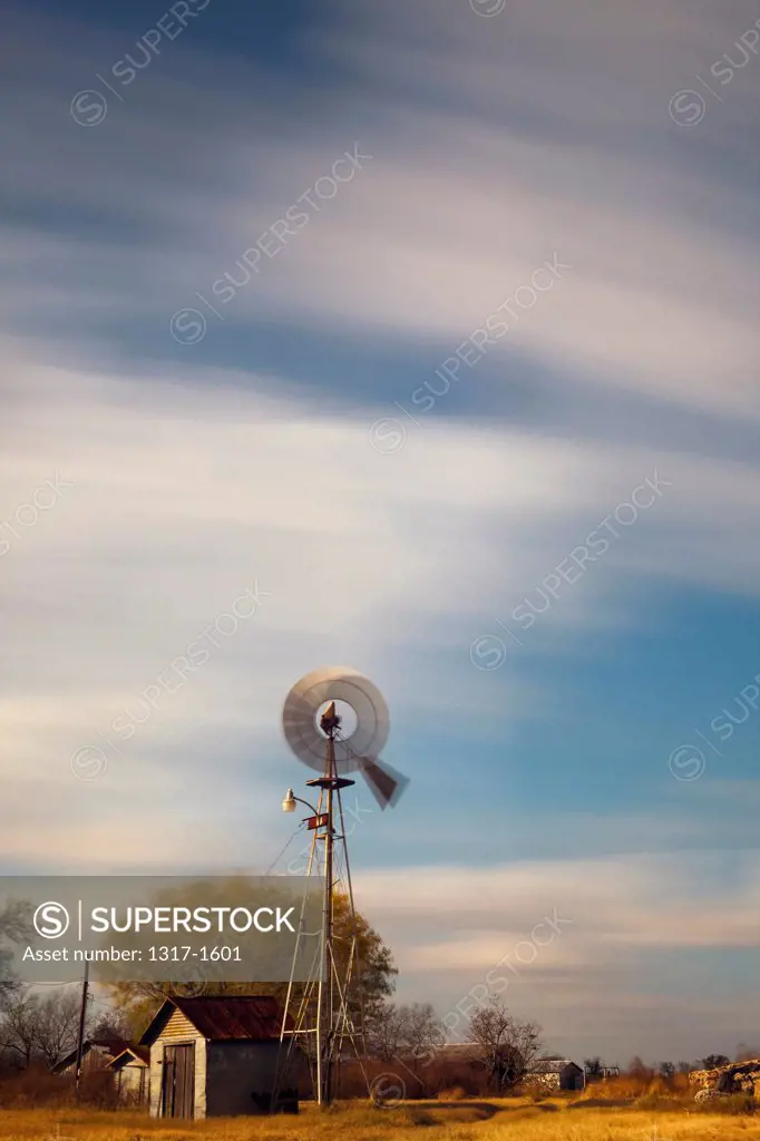 USA, Texas, Old Farm Truck and Windmill on farm