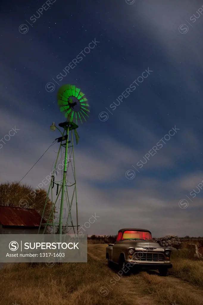 USA, Texas, Old Farm Truck and Windmill on farm