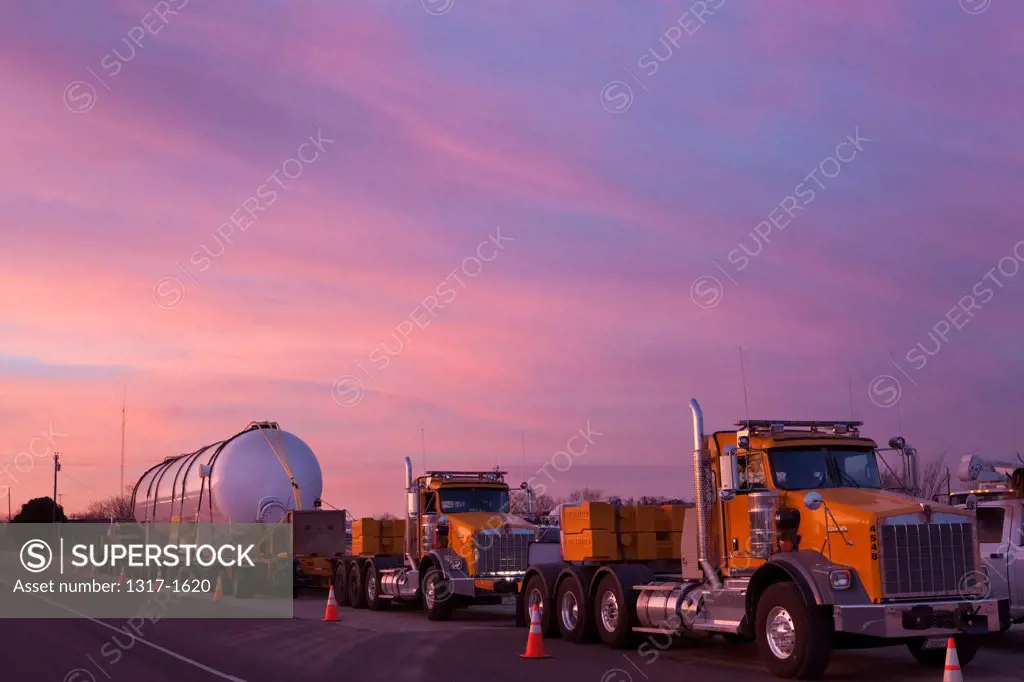 Oversize transportation trucks hauling oil equipment on the road