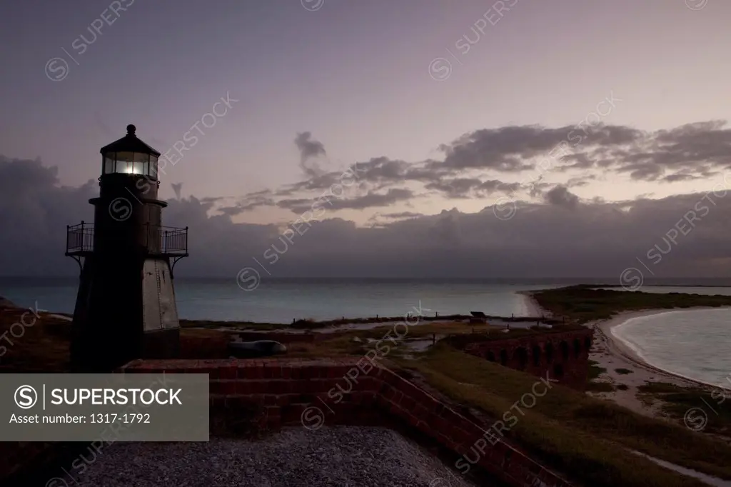 USA, Florida, Florida Keys, Dry Tortugas National Park, Fort Jefferson, Lighthouse during sunrise