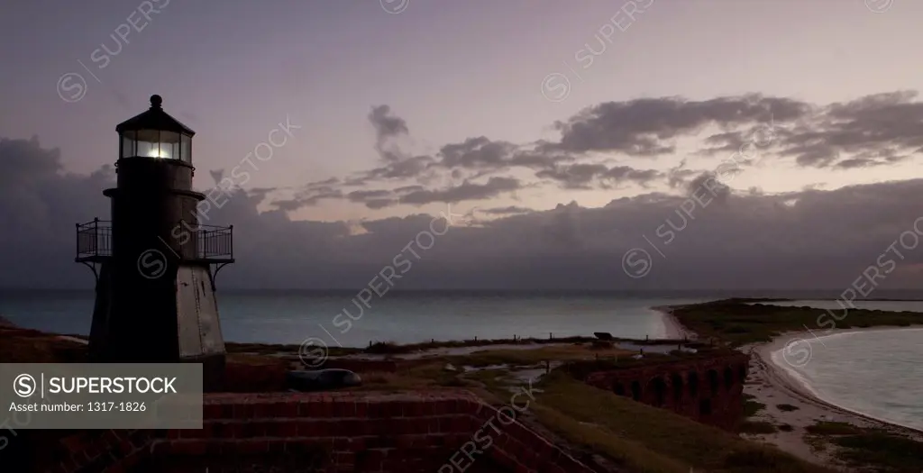 USA, Florida Keys Florida, Dry Tortugas National Park, Lighthouse during sunrise at Fort Jefferson