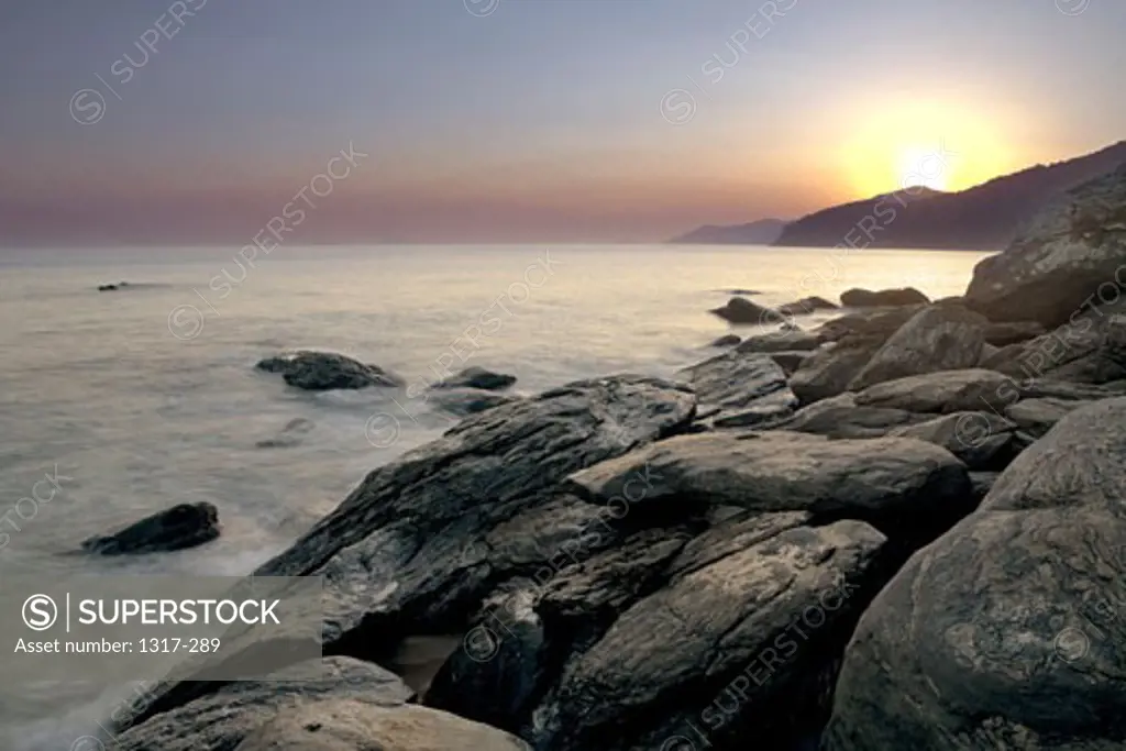 Rocky coast at sunset, Toque Toque Beach, Sao Sebastiao, Sao Paulo State, Brazil
