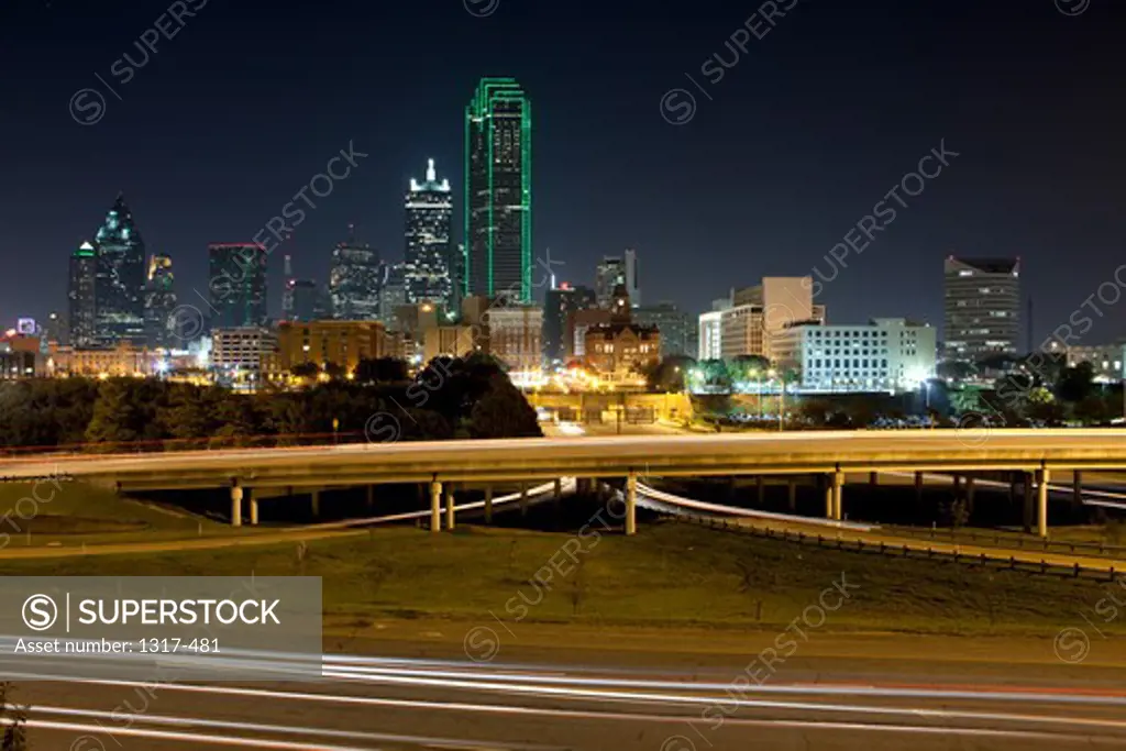 USA, Texas, Dallas, Skyscrapers and long exposure of traffic