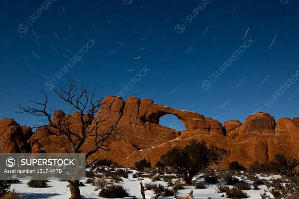 USA, Utah, Arches National Park, Star trails at Skyline Arch