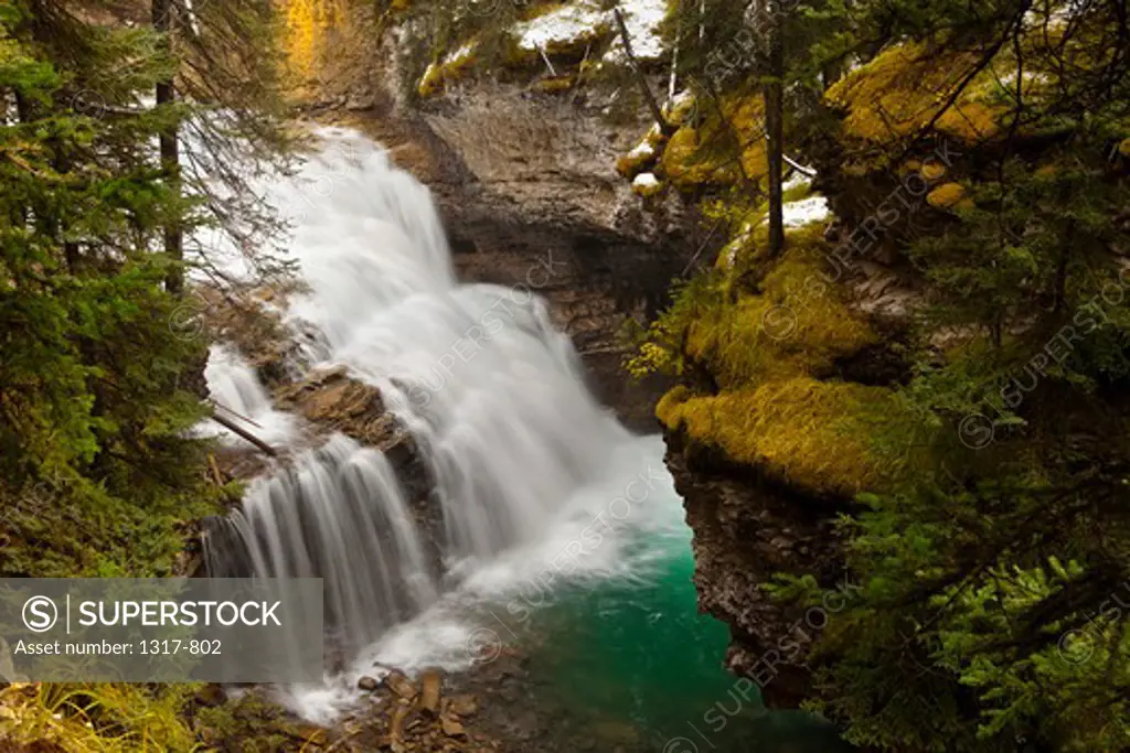 High angle view of a waterfall, Johnston Creek, Johnston Canyon, Bow Valley Parkway, Banff National Park, Alberta, Canada