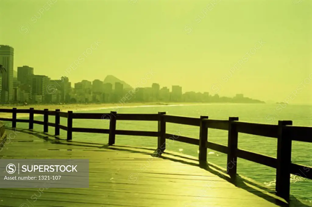 Pier at the sea with a cityscape in the background, Rio de Janeiro, Brazil