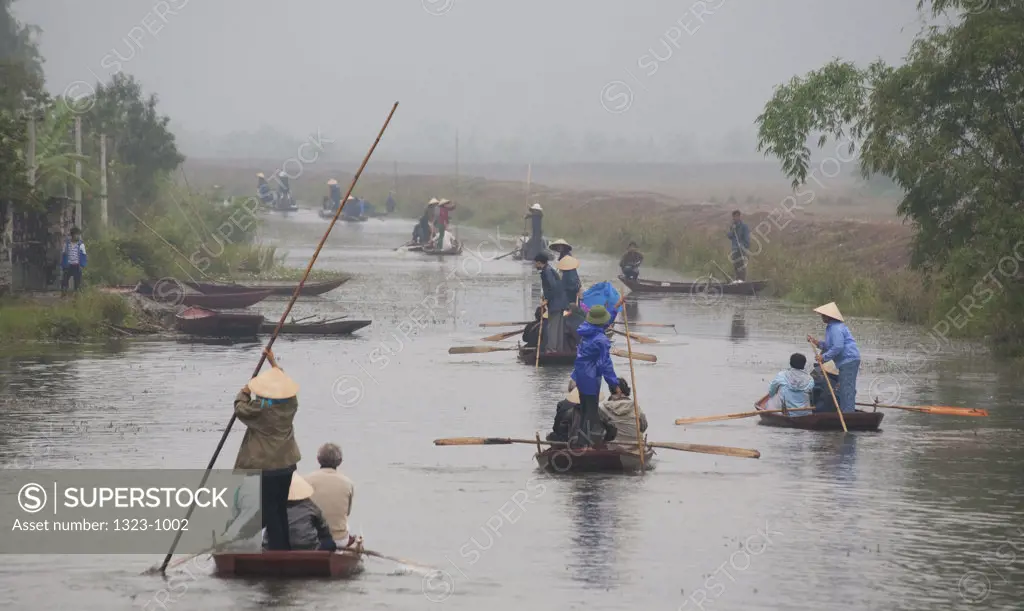 People rowing sampans in the river, Tam Coc, Vietnam