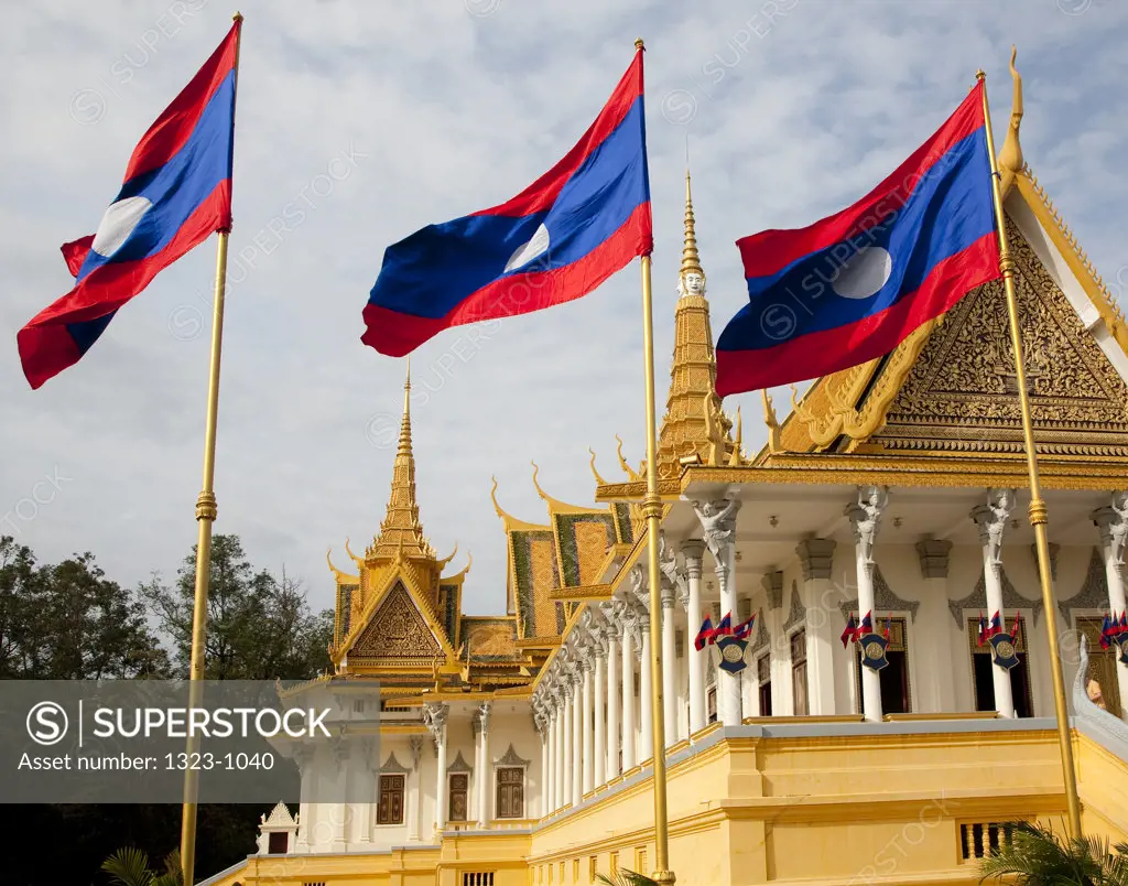 Laos flags in front of a palace, Royal Palace, Phnom Penh, Cambodia