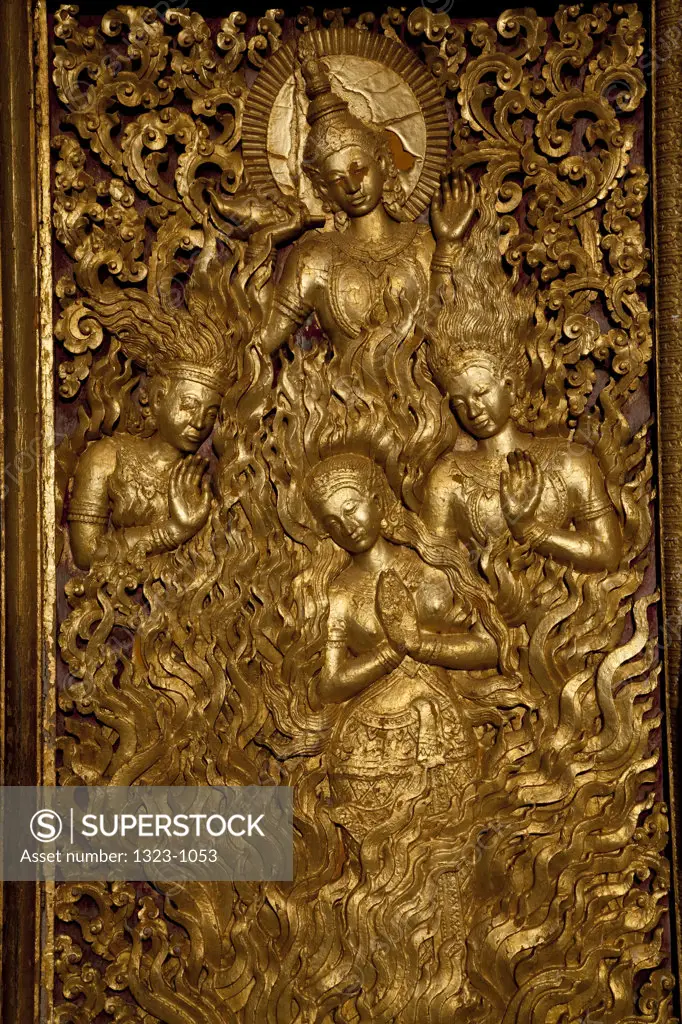 Details of carving on the golden door of a temple, Wat Mai Suwannaphumaham, Luang Phabang, Laos