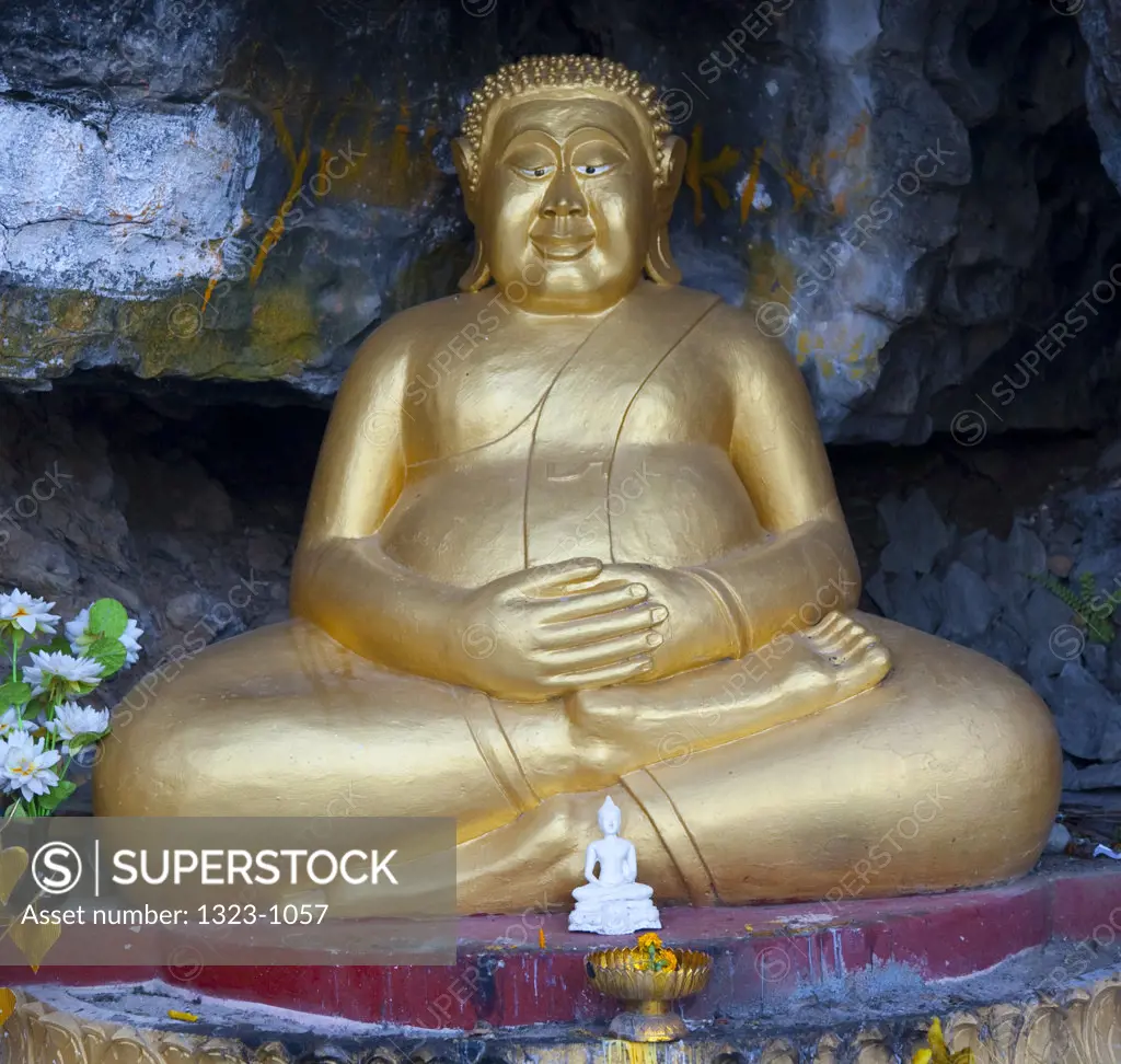 Statue of Happy Buddha in a temple, Wat Tham Phu Si, Mount Phousi, Luang Phabang, Laos