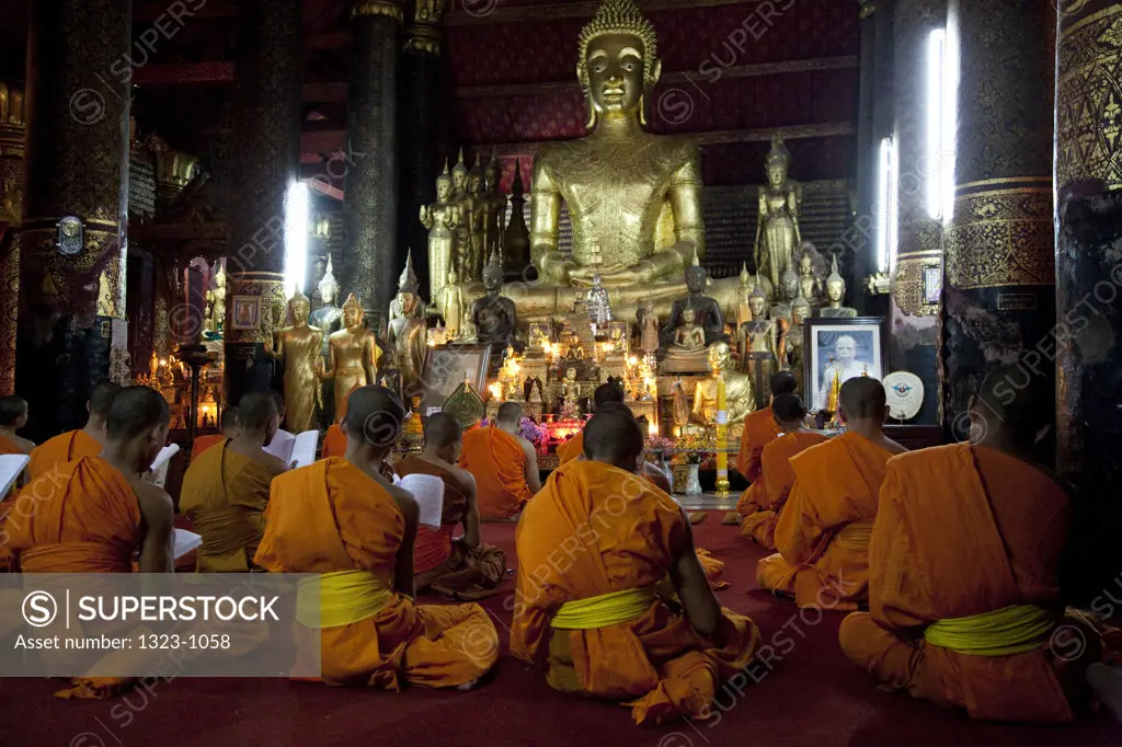 Monks chanting in a temple, Wat Xieng Muan, Luang Phabang, Laos