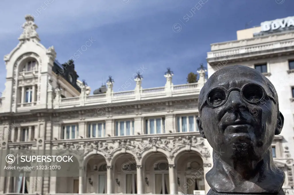 Low angle view of a statue in front of a building, Madrid, Spain