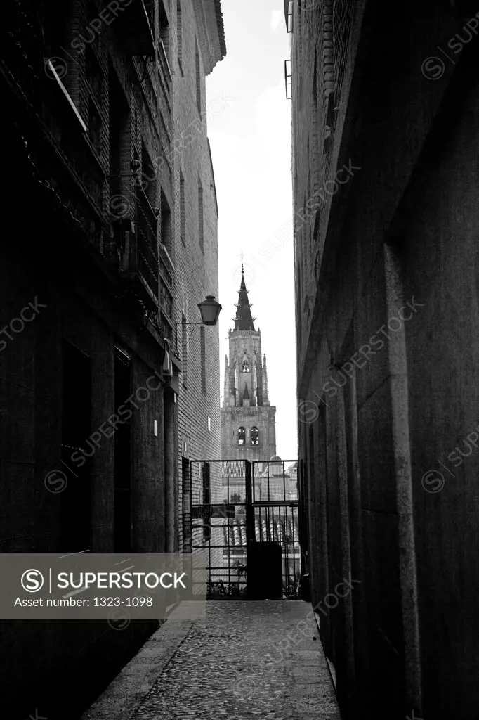 Church viewed through an alley, Toledo Cathedral, Toledo, Castilla La Mancha, Spain