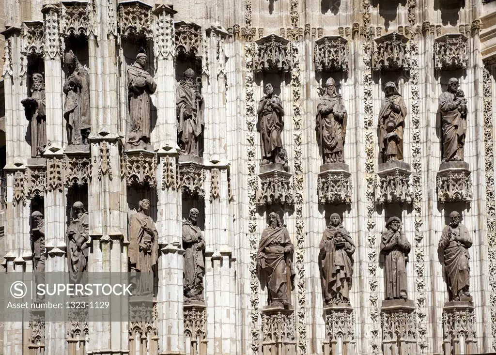Sculptured facade of a church, Seville Cathedral, Seville, Andalusia, Spain