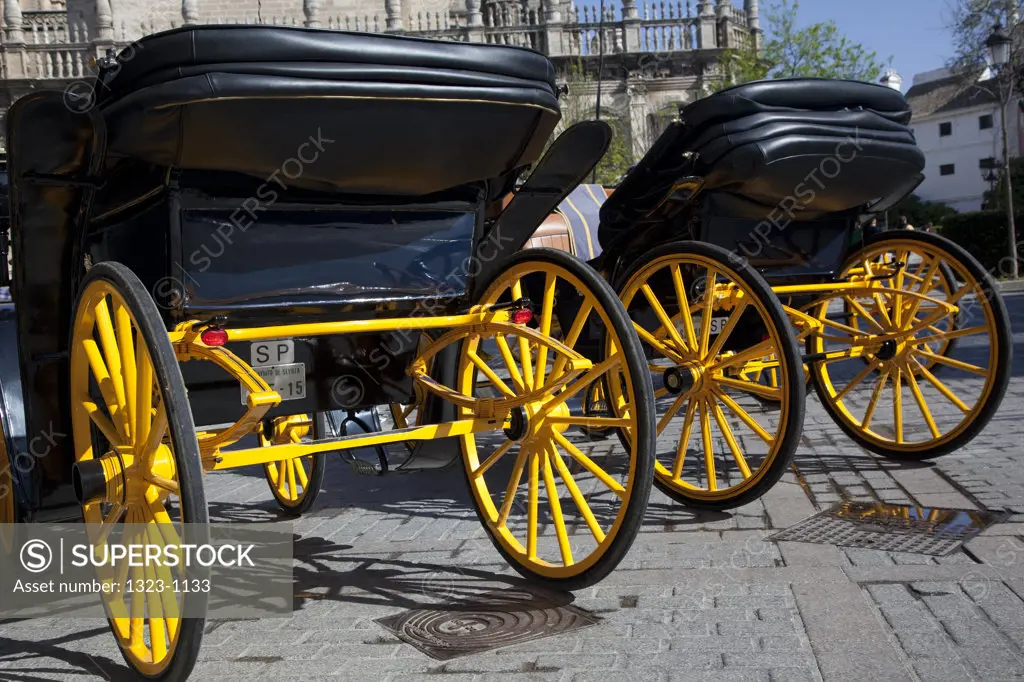 Horse buggies near a cathedral, Seville Cathedral, Seville, Andalusia, Spain