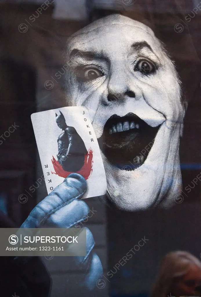 Plackard of Joker behind glass