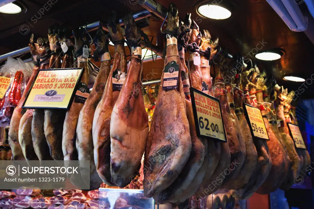 Barcelona, Spain,  dried hams hanging on market stale