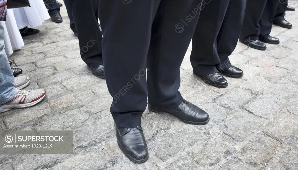 Spain, Seville, View of feet and shoes of marching band