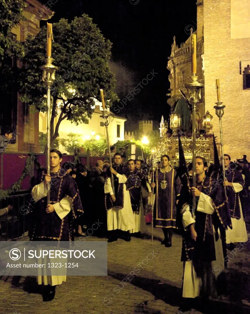 Spain, Seville, Ciriales and Nazarenes in procession